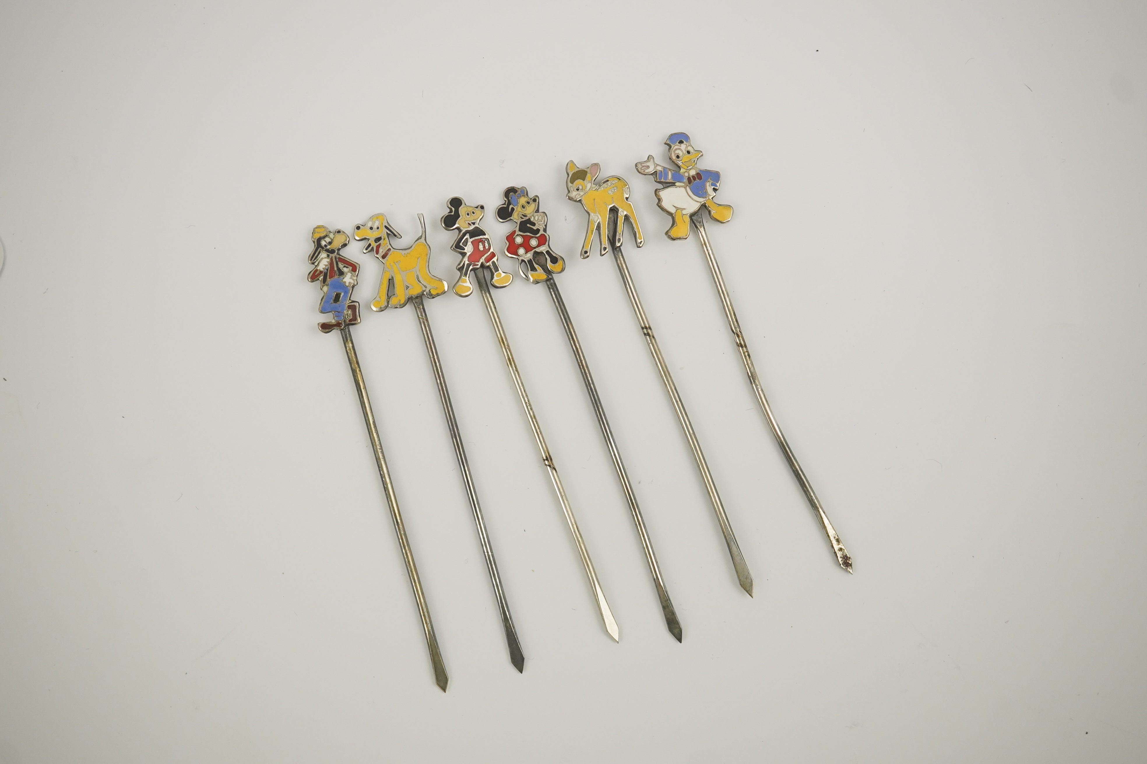 A cased set of six enamelled sterling Disney Character cocktail sticks